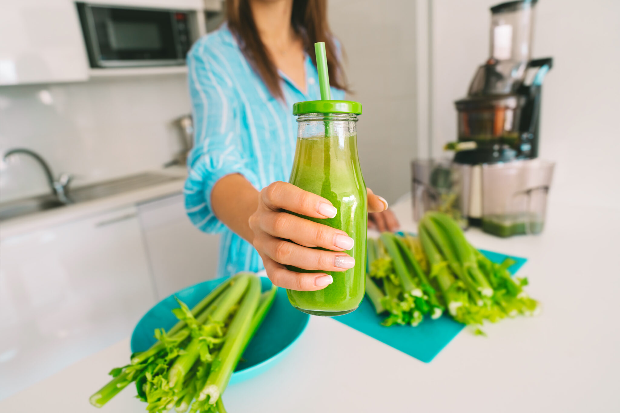 Fresh,Celery,Detox,Juice.,Healthy,Woman,Offering,Bottle,Of,Freshly