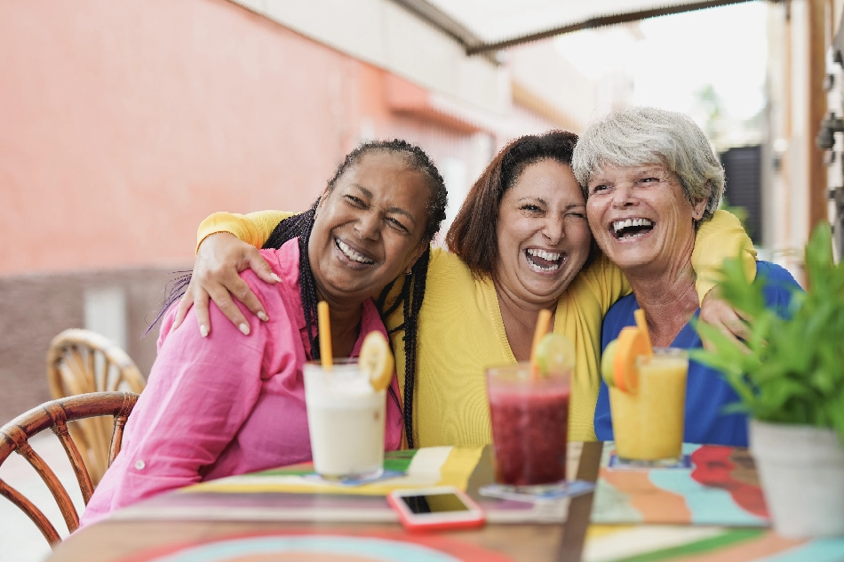 multiracial-mature-female-friends-having-fun-at-ba